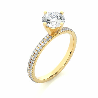 1.15 Carat Round Cut Prong Setting Diamond Ring With Side Accents In Yellow Gold