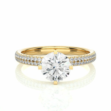 1.15 Carat Round Cut Prong Setting Diamond Ring With Side Accents In Yellow Gold