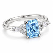 Angled view of 1.34 Carat Radiant Cut Diamond Ring with Marquise and Round Diamonds
