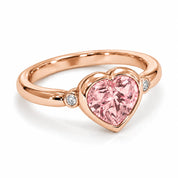 Angled View Of 1.72 Carat Fancy Pink Heart Cut 3 Stone Diamond Ring