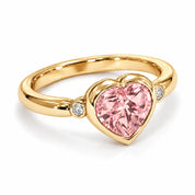 Angled View Of 1.72 Carat Fancy Pink Heart Cut 3 Stone Diamond Ring