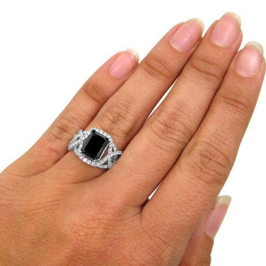 5.50 Carat Emerald Shape Prong Setting Twisted Black and White Diamond Ring