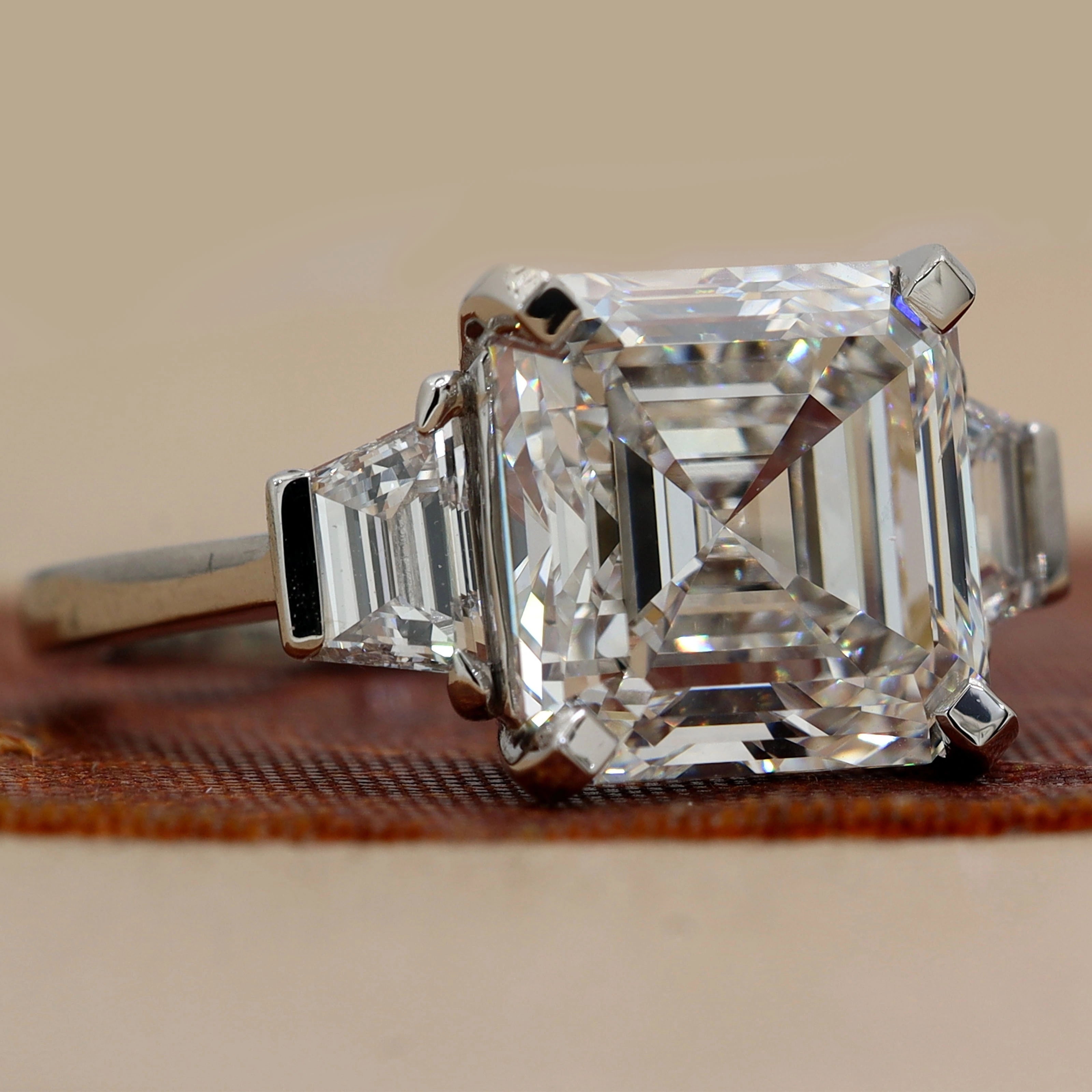 Stone View Of 6.84 Ct Asscher Cut Three Stone Diamond Engagement Ring with Step-Cut Side Stones