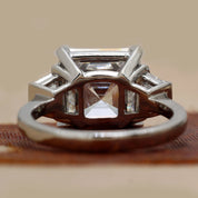 Back View Of 6.84 Ct Asscher Cut Three Stone Diamond Engagement Ring with Step-Cut Side Stones