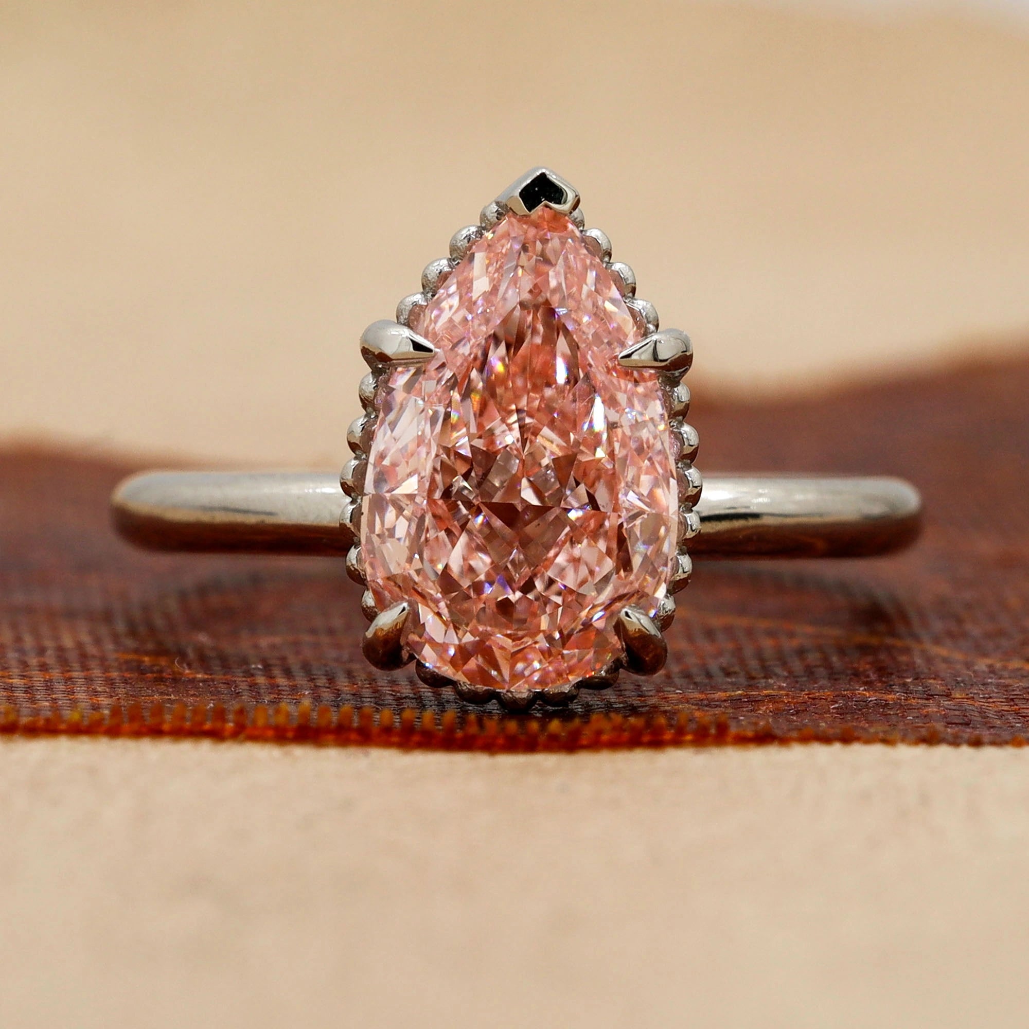 Front View of 3 Carat Pink Pear Cut Diamond Solitaire Ring with Plain Band in Prong Setting