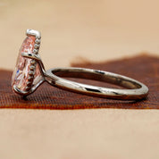 Side view of 3 Carat Pink Pear Cut Diamond Solitaire Ring with Plain Band in Prong Setting