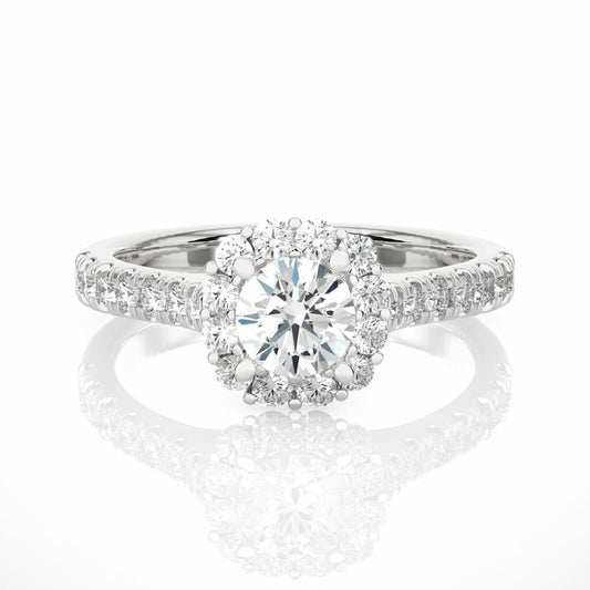 A round cut lab grown diamond halo engagement ring with a prominent central diamond surrounded by smaller diamonds set in a white gold band.
