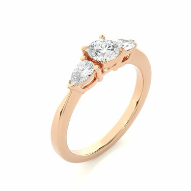 1 Carat Pear And Round Shape Three Stone Prong Set Diamond Ring in Rose Gold